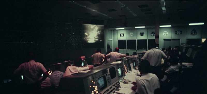 Neil Armstrong getting ready to move the TV camera now