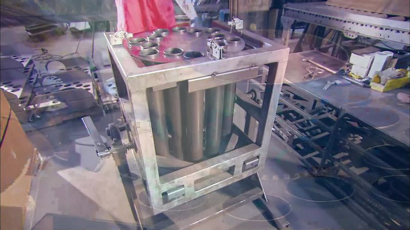 NEXT, HE ASSEMBLES THE SECTION IN WHICH HOT GASES COLLECT