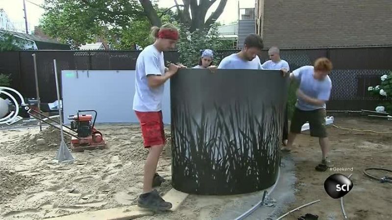 NEXT, THEY UNROLL THE POOL WALL