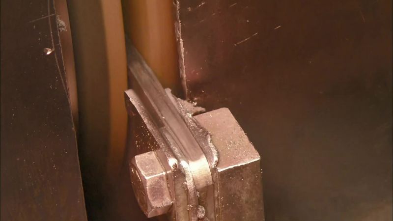 NEXT, WORKERS INSERT THE CUTTING PLIERS