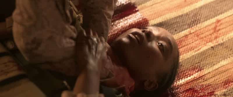 Nile! Nile! You're okay. It's okay. Stay with me. Just look at me. Look at me. Okay. Medic's on thei