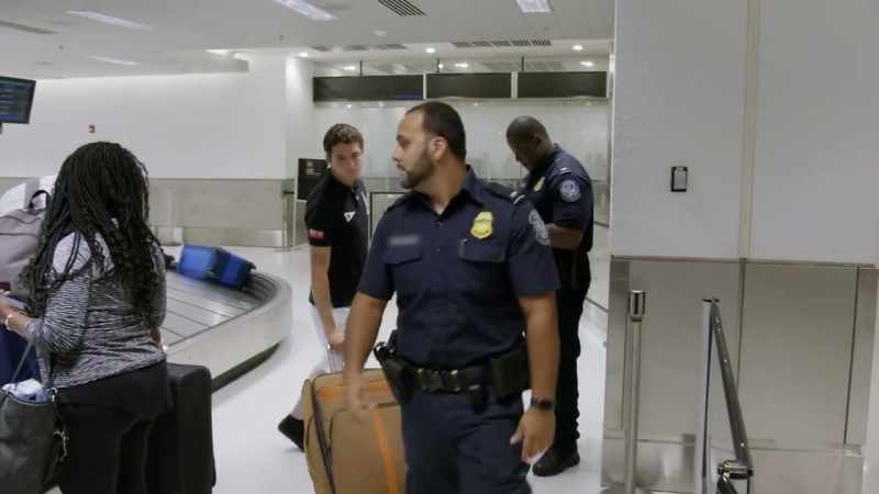 OFFICER: Come on. Let's go. Follow me
