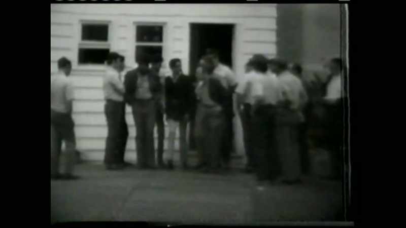 [Officer] Presently entering is Bobby Seale