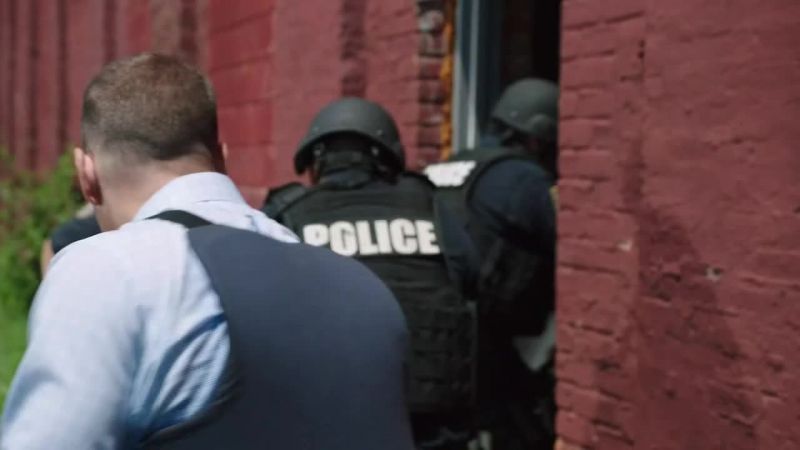 (officers shouting)