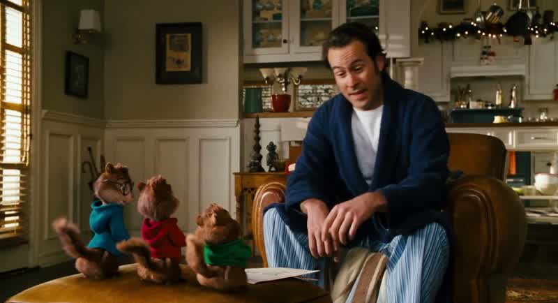 Oh niceIy done Theodore ''To Dav ''Let's see it says ''Merry Christmas Love Theodore ''And it's got a nice picture of some pineappIesThose aren't pineappIes That's our famiIy