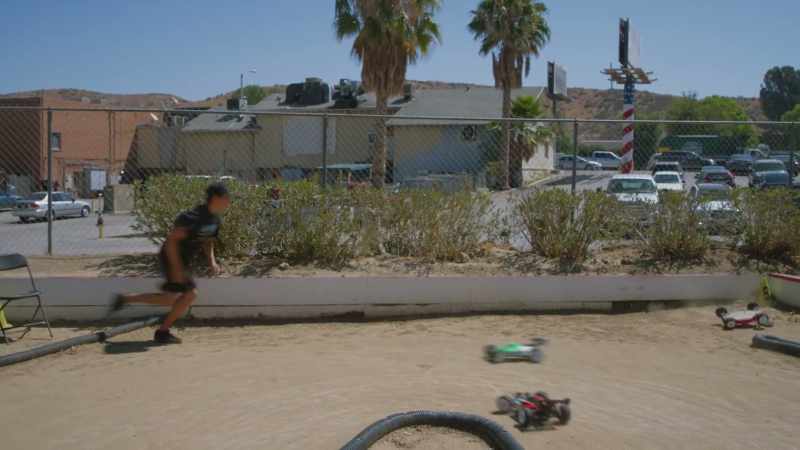 Oh! The newcomer shoots right into the first turn!