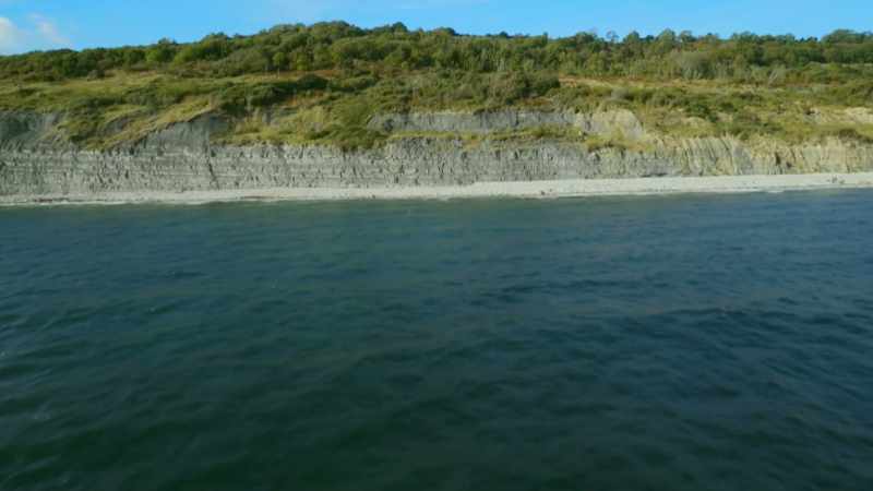 On its floor, sediments washed down from the land