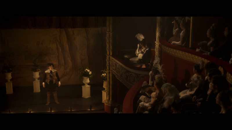 [orchestra playing 