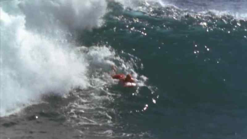 Others like to ride a short belly board and get a short ride