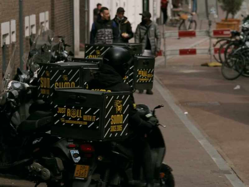 Over her uniform, she had thrown a Dutch flag