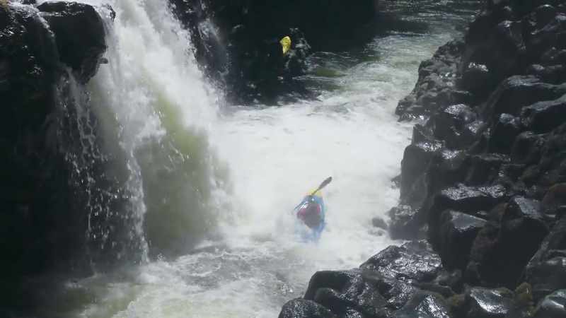 Paddling and battling through the waterfall