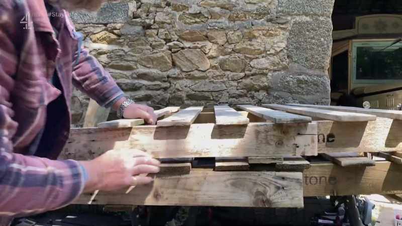 (pallets banging)