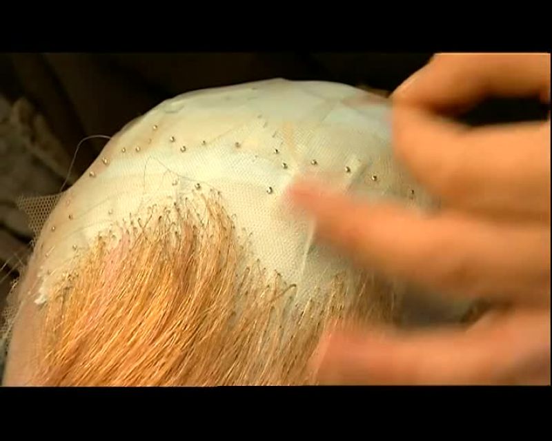 PARTWAY INTO THE JOB, HE COMBS OUT ANY TANGLES