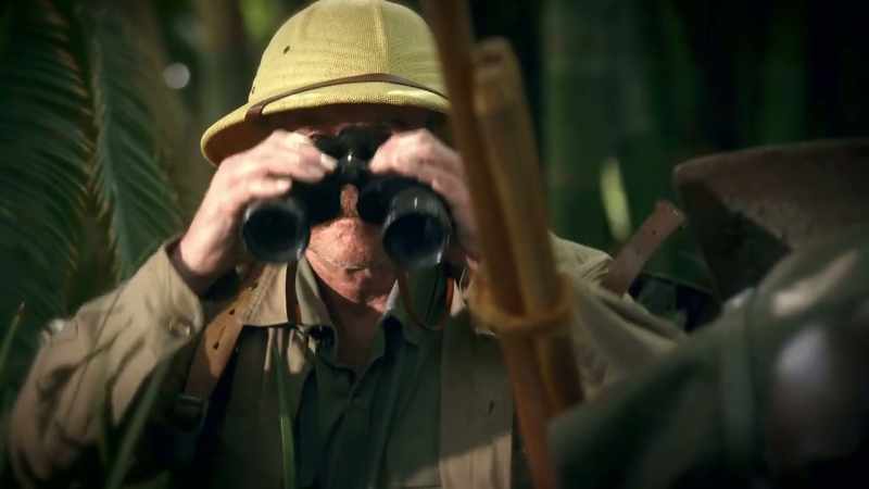 Peering through binoculars