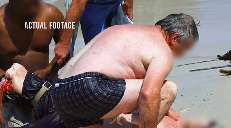 People at the scene stabilize Cohen until