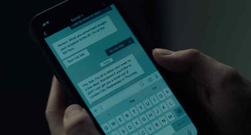 [phone buzzes]