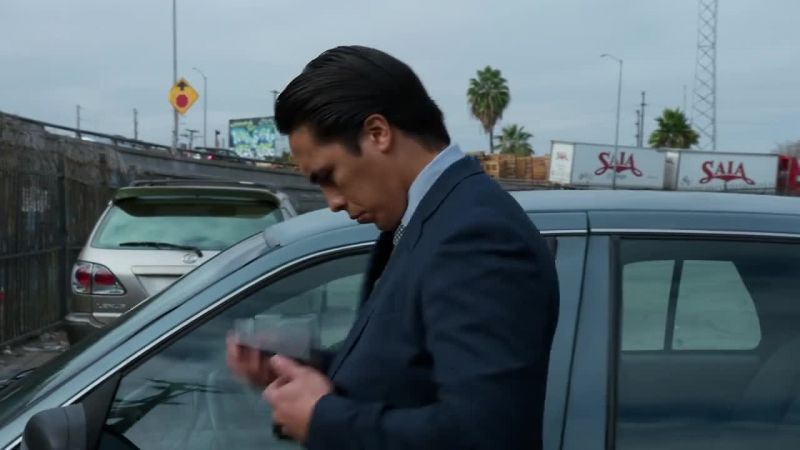 [phone buzzing]