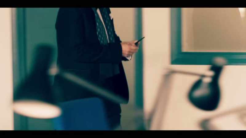 PHONE'S BEEP. INDISTINCT CHATTER