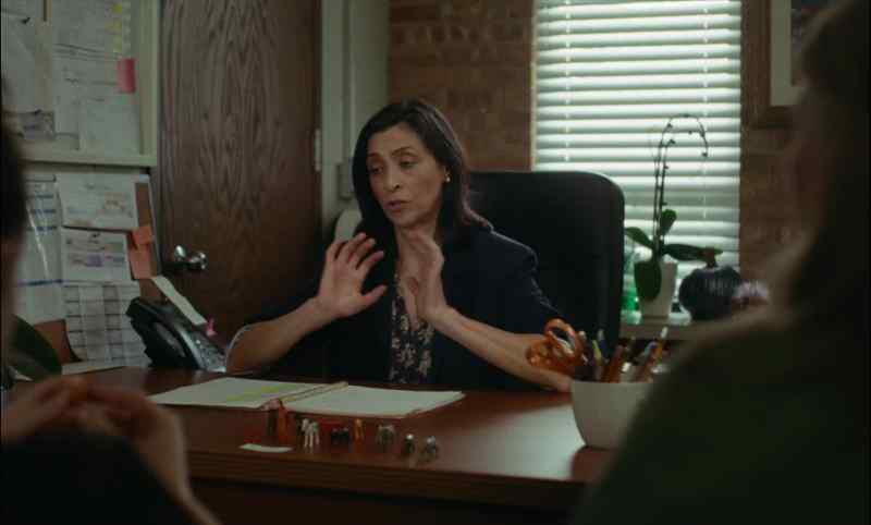 Physically, two hands, in front of the class