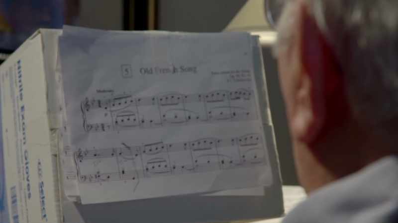 ( piano music playing )