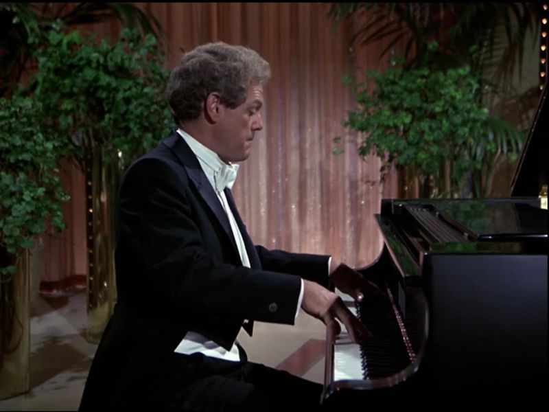 [Playing piano]