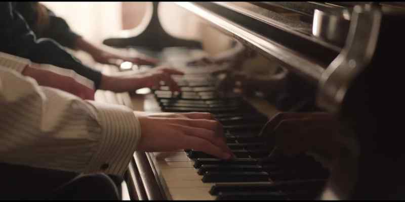 [playing simple melody] - [quiet chatter]