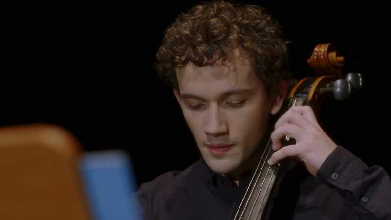 [plays cello]
