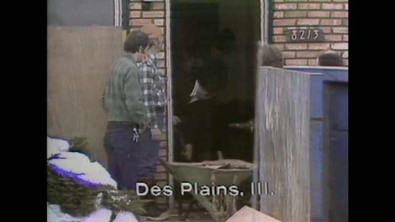 Police investigators using sledgehammers, axes and chain