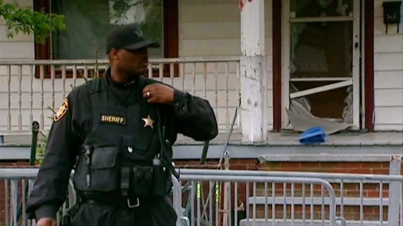 (POLICE RADIO, INDISTINCT CHATTER)