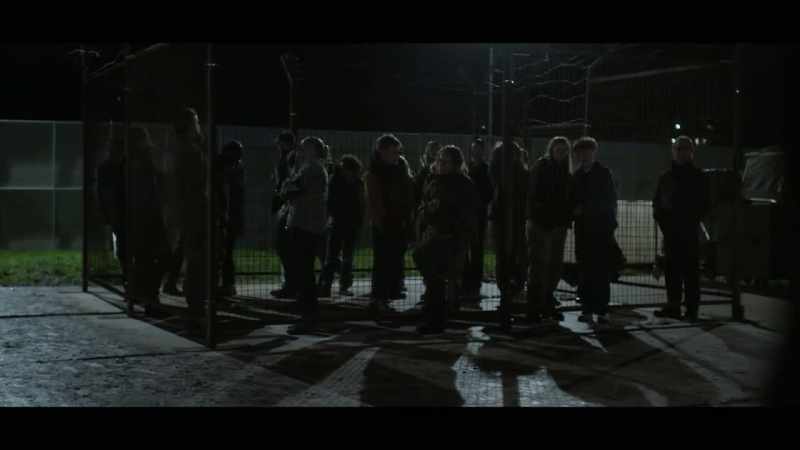 PRISONERS CHATTER INDISTINCTLY