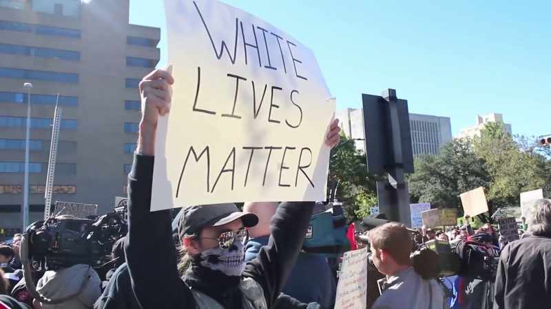 (protesters chattering)