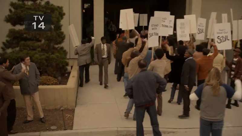 (protestors shouting)