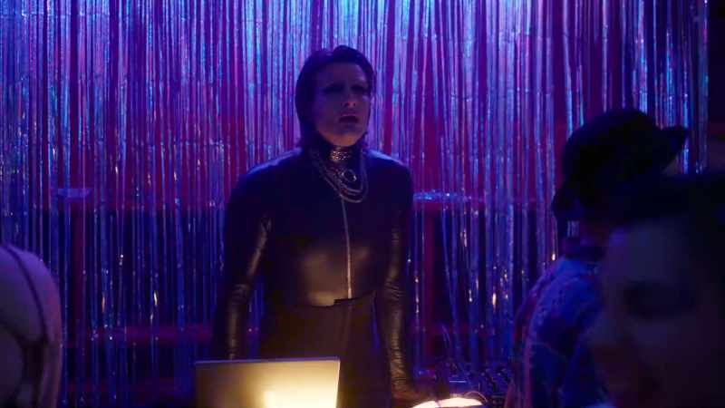 [pulsating club music] [lively chatter]