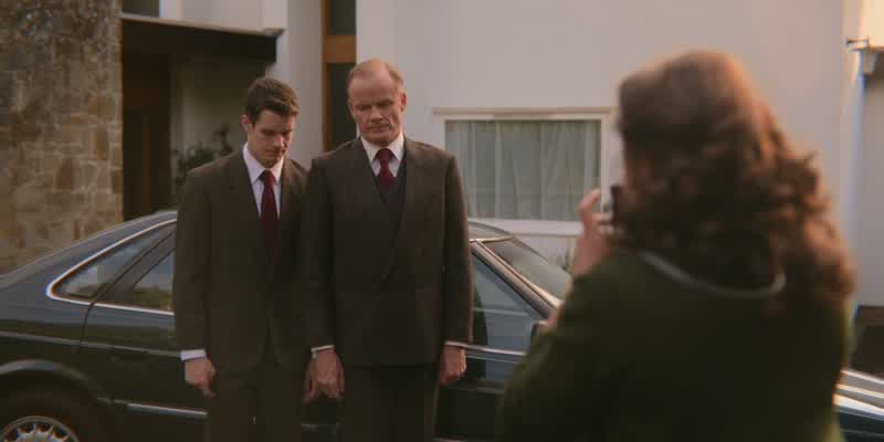 Put your arm round him, love
