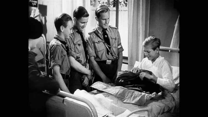 Quex finds recognition through the Hitler Youth uniform