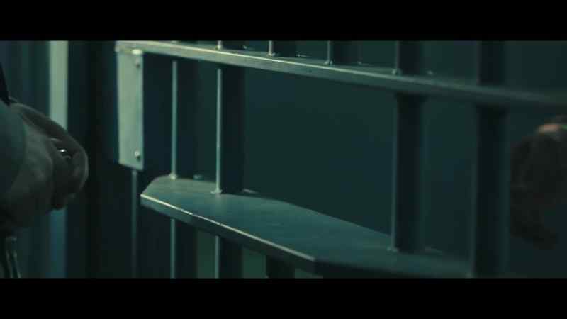 [quiet prison chatter]