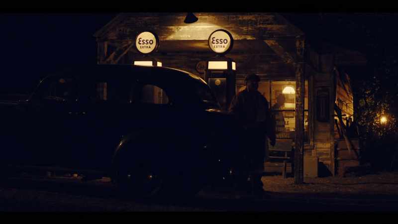 (RADIO PLAYS INSIDE BUILDING) -(GAS PUMP DINGS)
