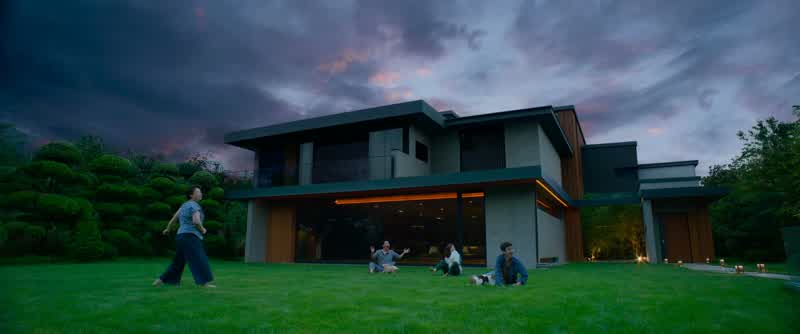 Rain falling on the lawn,as we sip our whiskey