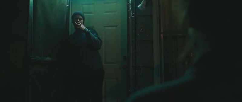 [rap music, muffled]