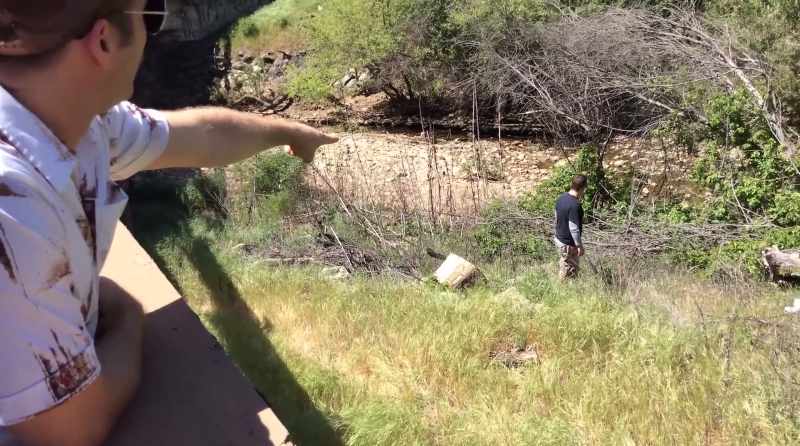 Right by the log, right where your hand is