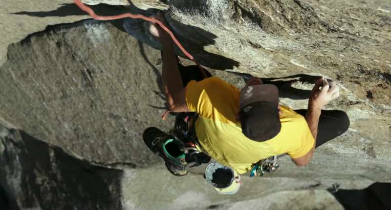 Right hand goes up to a small down-pulling crimp, left foot goes into a little dish