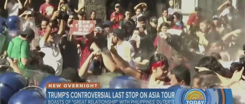 Riot police using water cannons to disperse the crowds