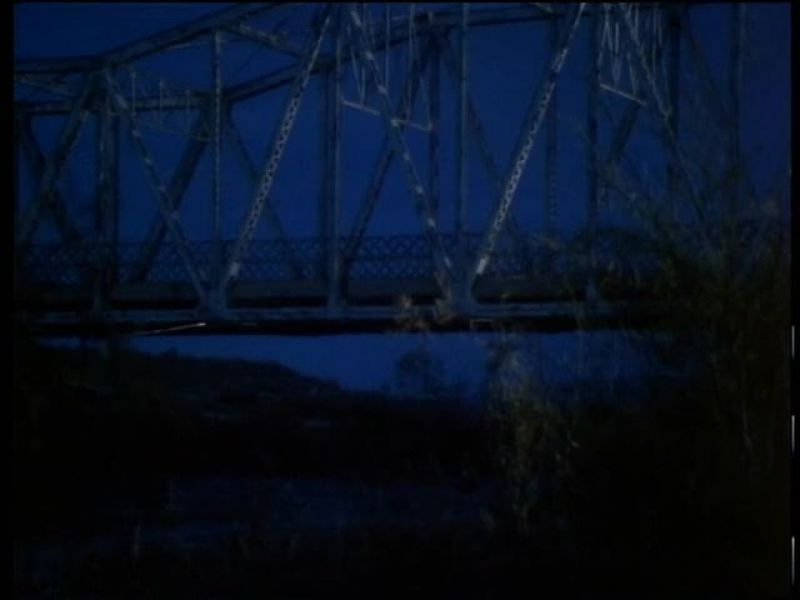 ROBERT STACK (VOICEOVER): On a little-used suspension bridge