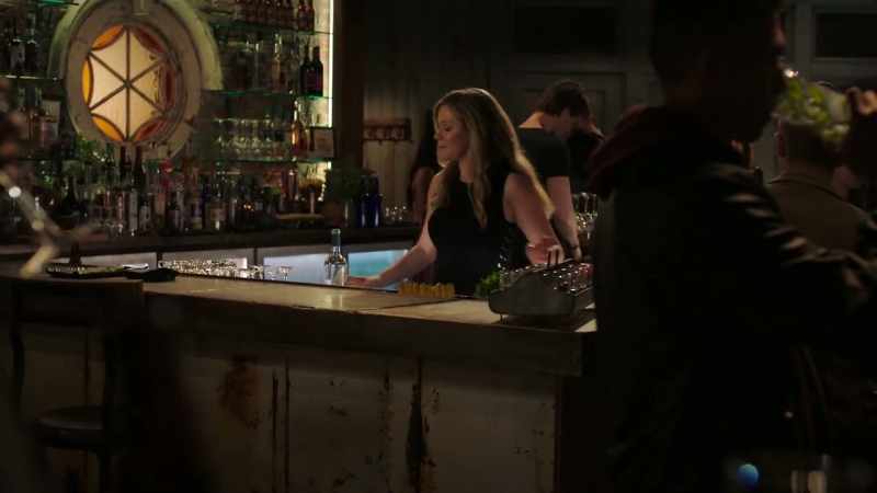 [rock music playing lightly over speakers]