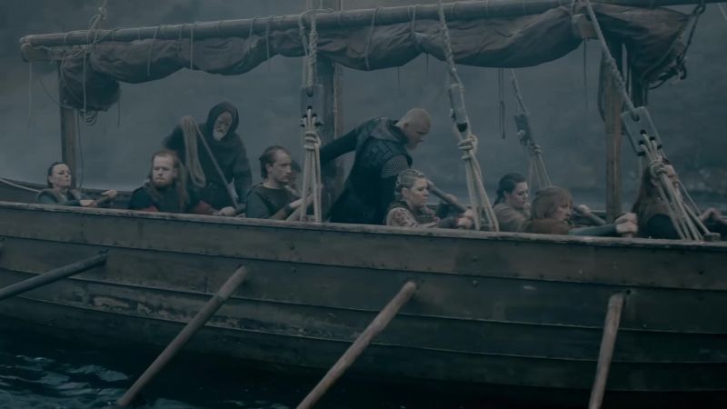 [rowers grunting]