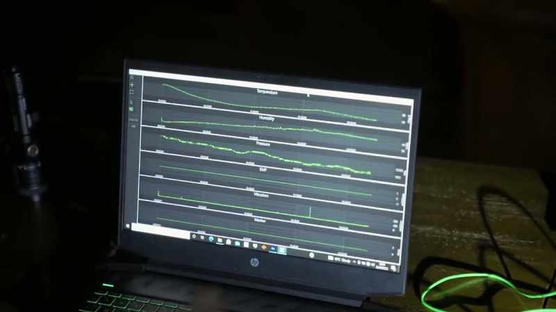 Ryan checks the data from our encounter in the Caithness Room