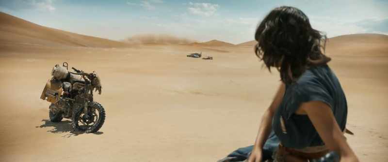 [sand blowing]