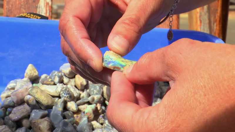 Sand embedded in the opal