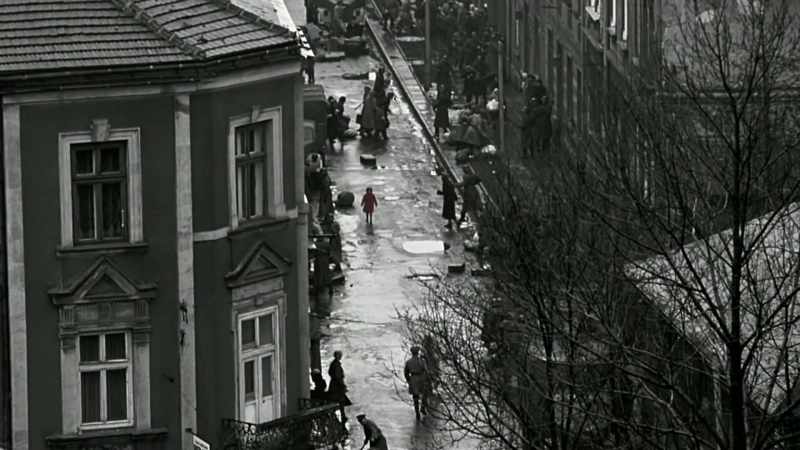 Schindler on horseback watching these people being rounded up