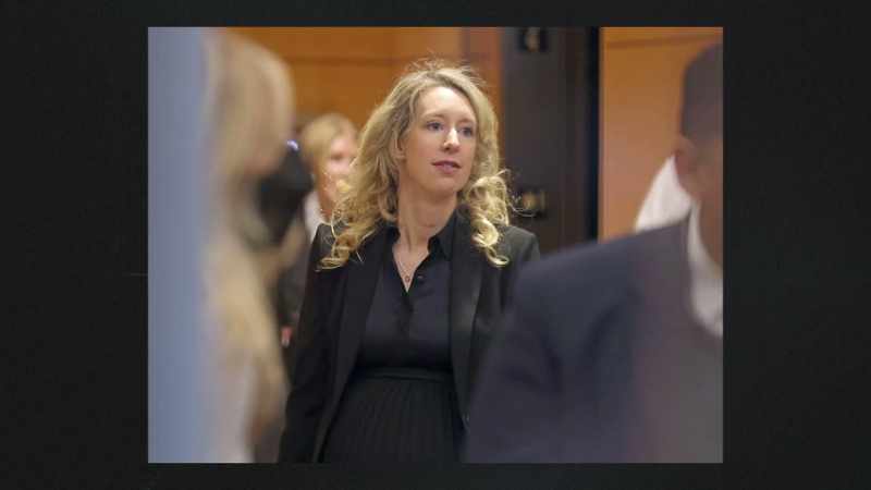 SCOTT: Holmes has since ditched her signature black turtleneck